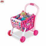 Pink toy shopping cart with colorful items on a white background