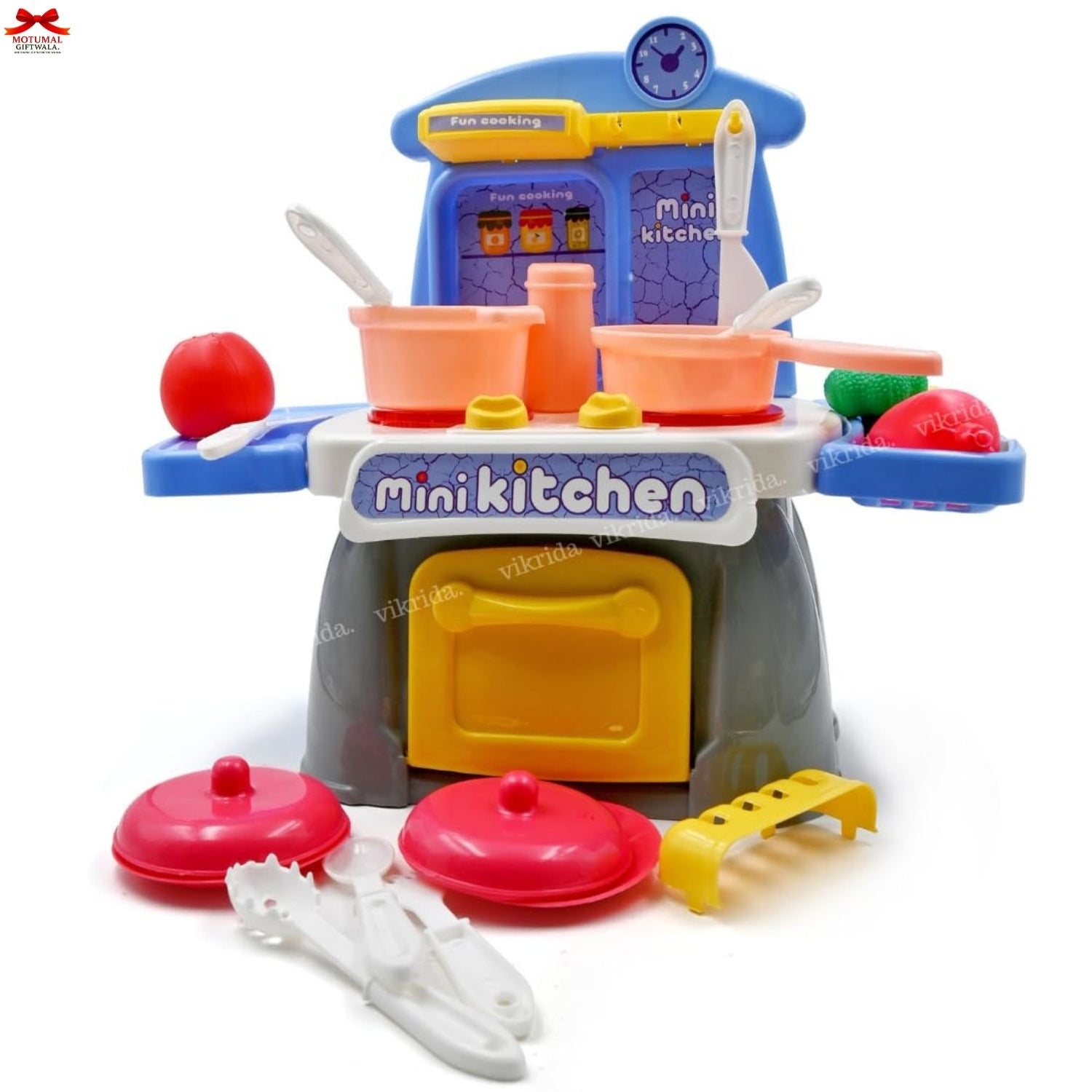 Colorful toy kitchen set with various utensils on a white background