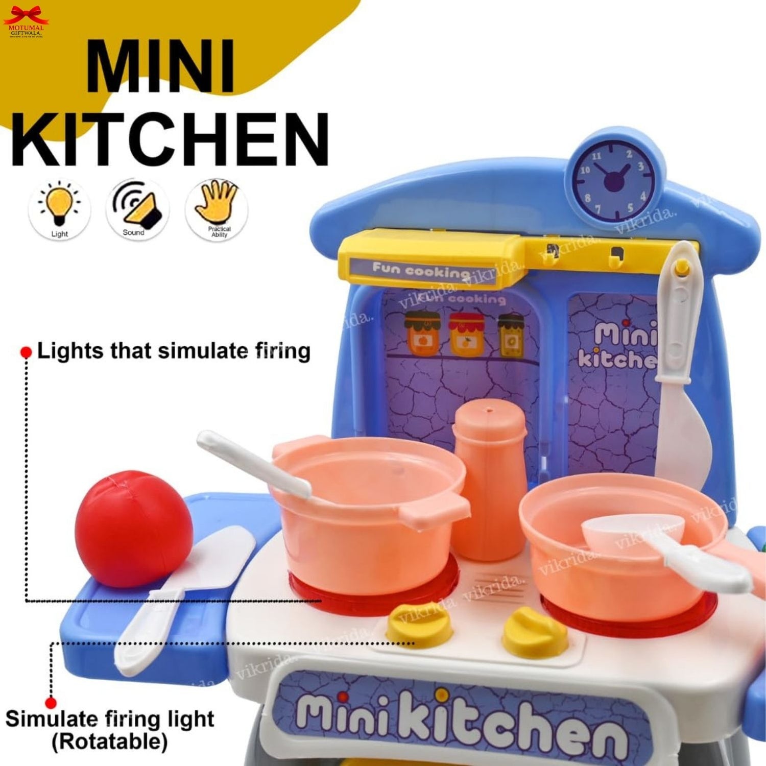 Toy kitchen set with various utensils and appliances on a white background