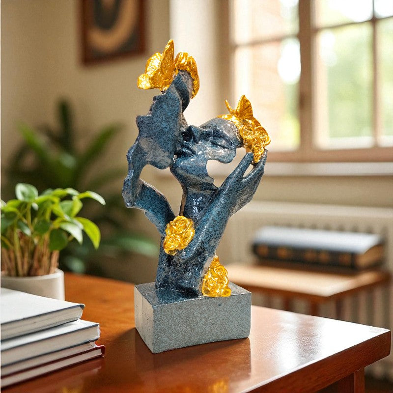 Decorative sculpture on a table with a blurred indoor background