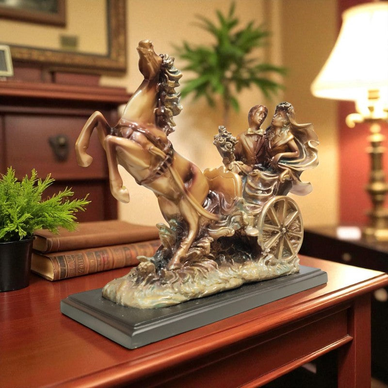 Decorative sculpture of a horse pulling a chariot on a wooden surface.