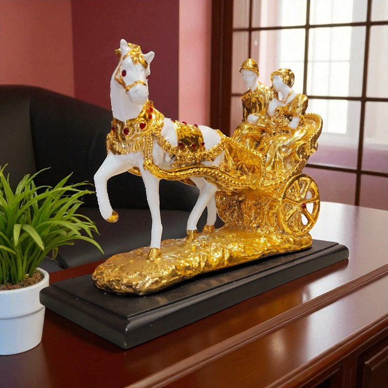 Decorative figure of a white horse with gold carriage and riders on a wooden surface.