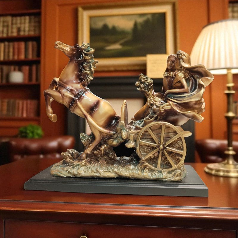 Decorative sculpture of a woman riding a horse-drawn cart on a wooden surface.