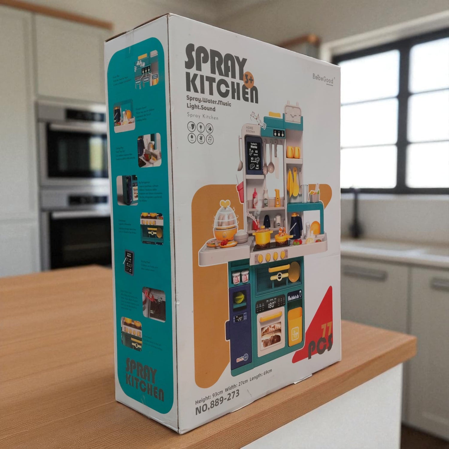 Angled view of Spray Kitchen Set packaging displaying features and colorful accessories for pretend cooking play