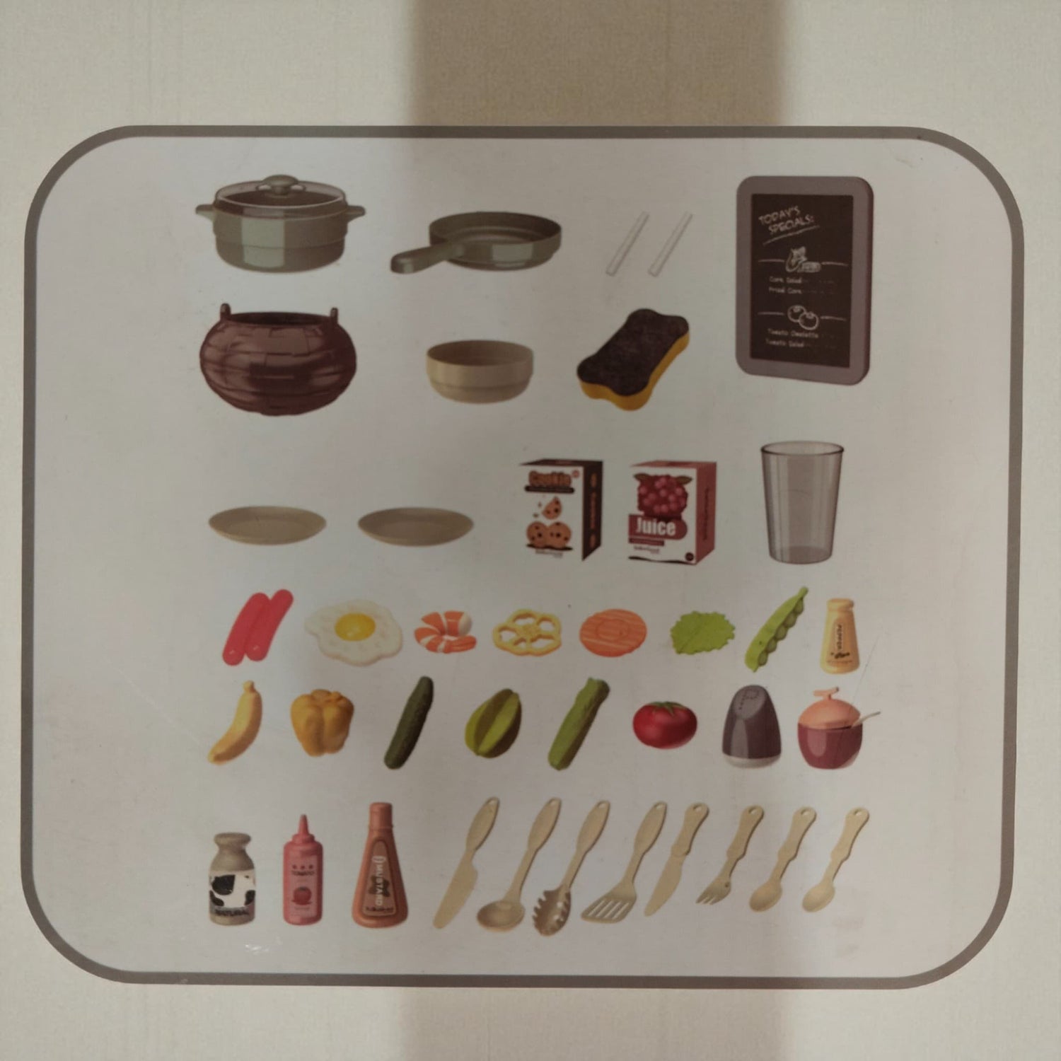 Image showing all 43 accessories included with Spraying Mist Kitchen toy set including pots, pans, vegetables, and utensils